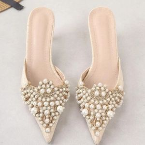 Kitten heel pearly mules...never worn